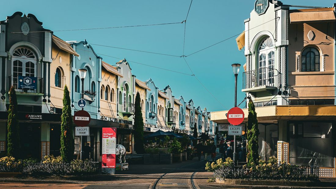 Pastel shopfronts and tram tracks on New Regent Street, Christchurch